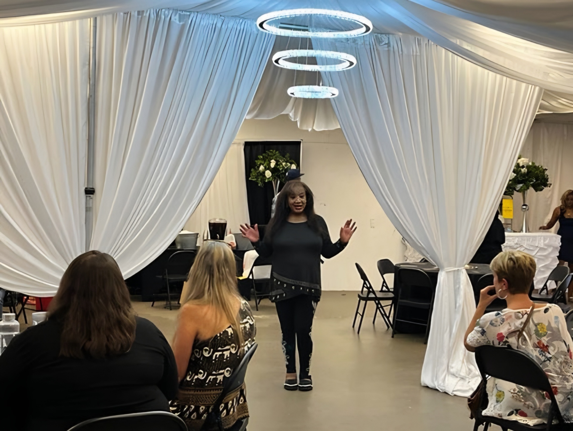 Ericka Boussarhane speaking to a live audience